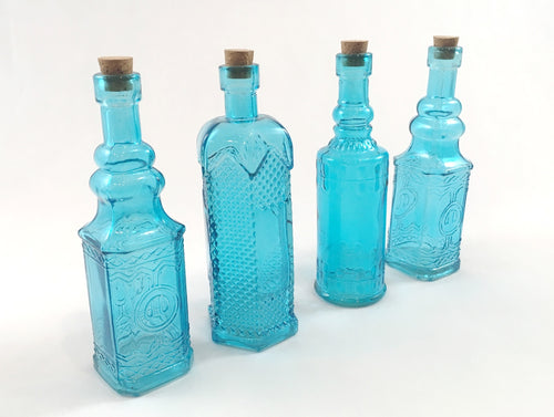 Assorted Blue Glass Bottles with Corks